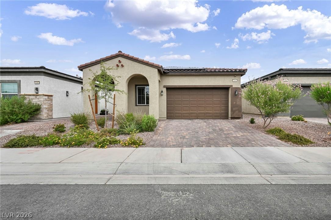 Image 2: A welcoming facade, blending traditional stucco wi