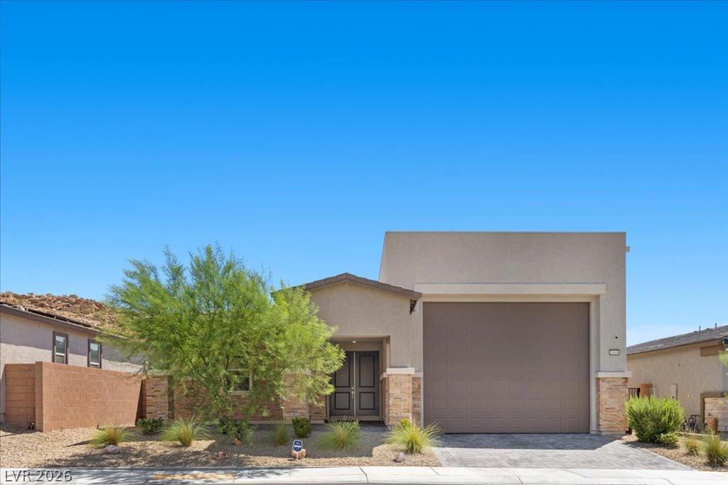 Image 2: A modern desert dwelling features a two-car garage