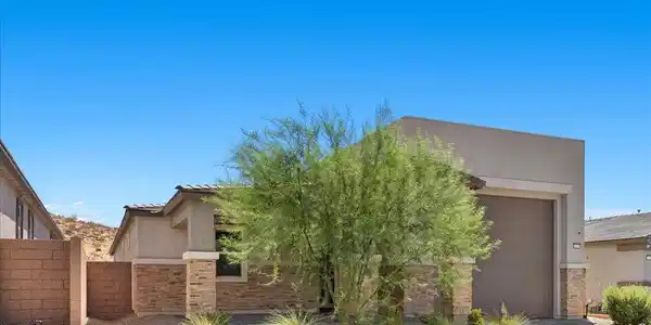 Image 3: A desert-friendly facade with stone accents and a