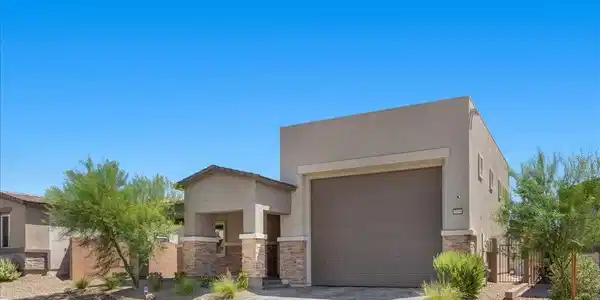 Image 4: A well-maintained facade features an integrated ga