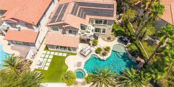 Image 3: An aerial perspective reveals a luxurious backyard