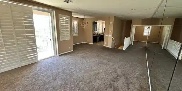 Image 4: Unfurnished living room with arched walkways and d