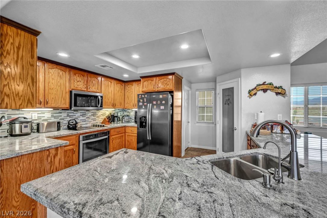 Image 1: Culinary delights await in this kitchen featuring
