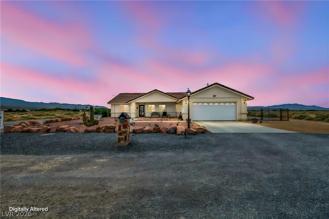 Image 2: A desert oasis with inviting curb appeal, this hom