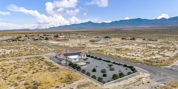 Image 4: Perched amidst a vast desert expanse, this home of