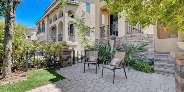 Image 2: An inviting stone-paved patio offers a quiet outdo