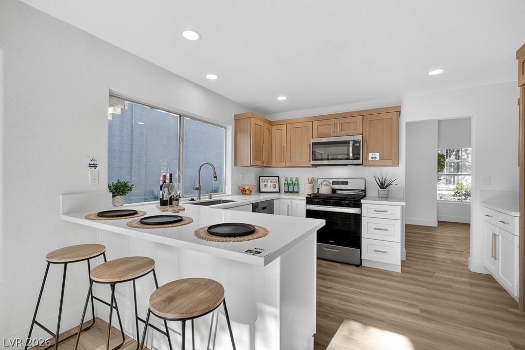 Image 3: A well-appointed kitchen showcasing an inviting br