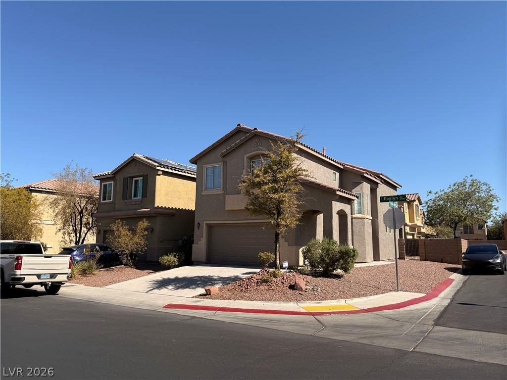 Image 2: A corner lot residence boasts desert-friendly land