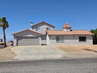 Image 2: A spacious driveway and attached garage complement