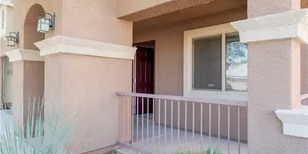 Image 3: An inviting front porch features stucco detailing