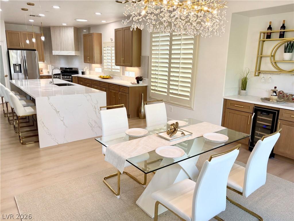 Image 2: A well-appointed kitchen and dining area features