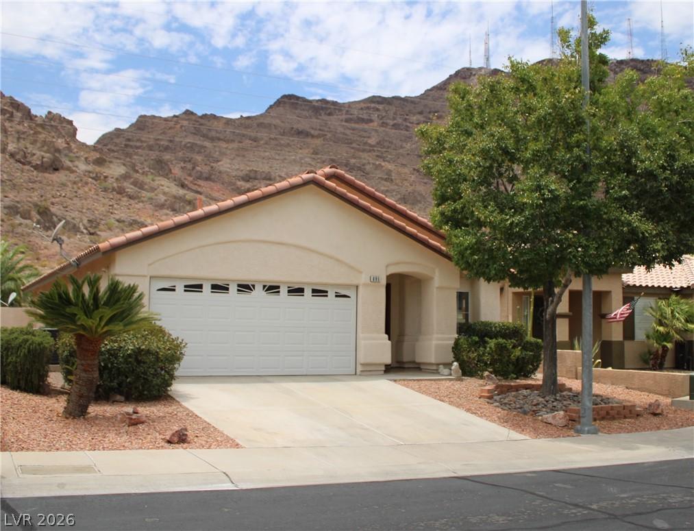 Image 2: A desert-modern home with a two-car garage feature