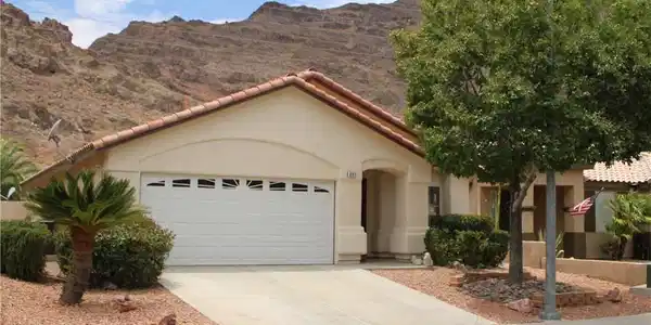 Image 2: A desert-modern home with a two-car garage feature