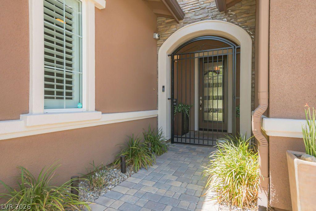 Image 4: An inviting stone pathway leads to a secure wrough