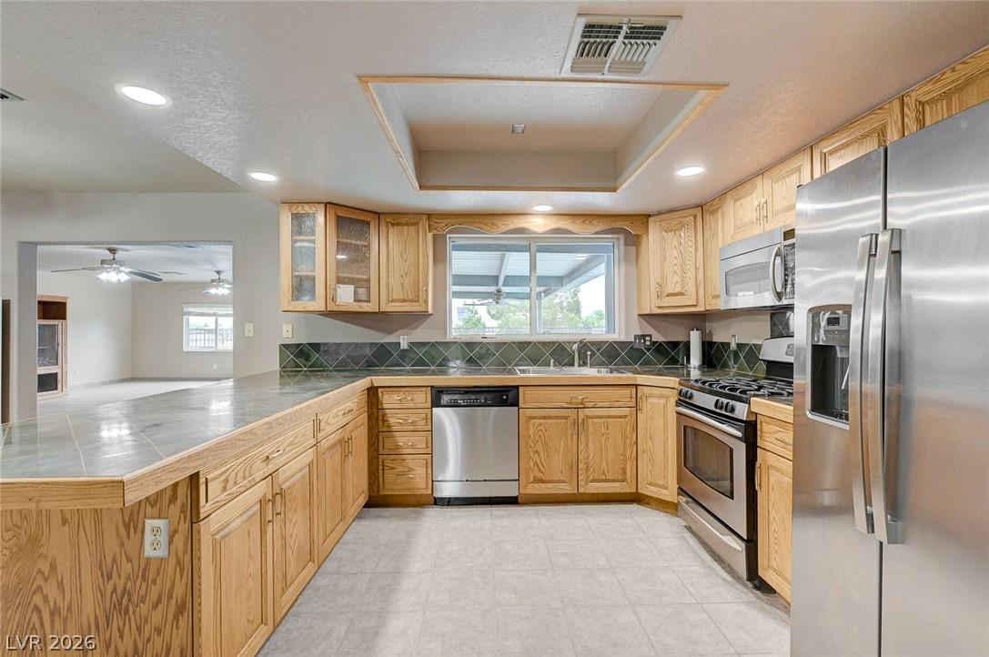 Image 2: Kitchen with stainless steel appliances, recessed