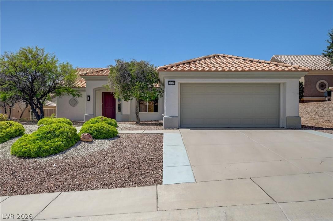 Image 2: This desert oasis features a classic tile roof and