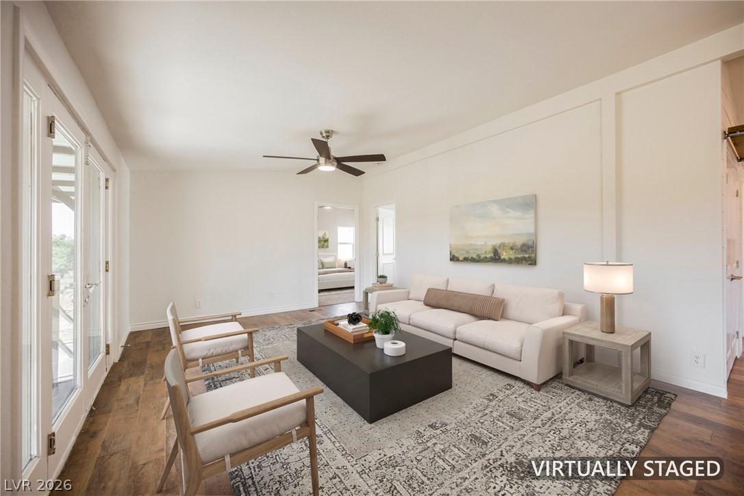 Image 3: French doors open to reveal this inviting living a