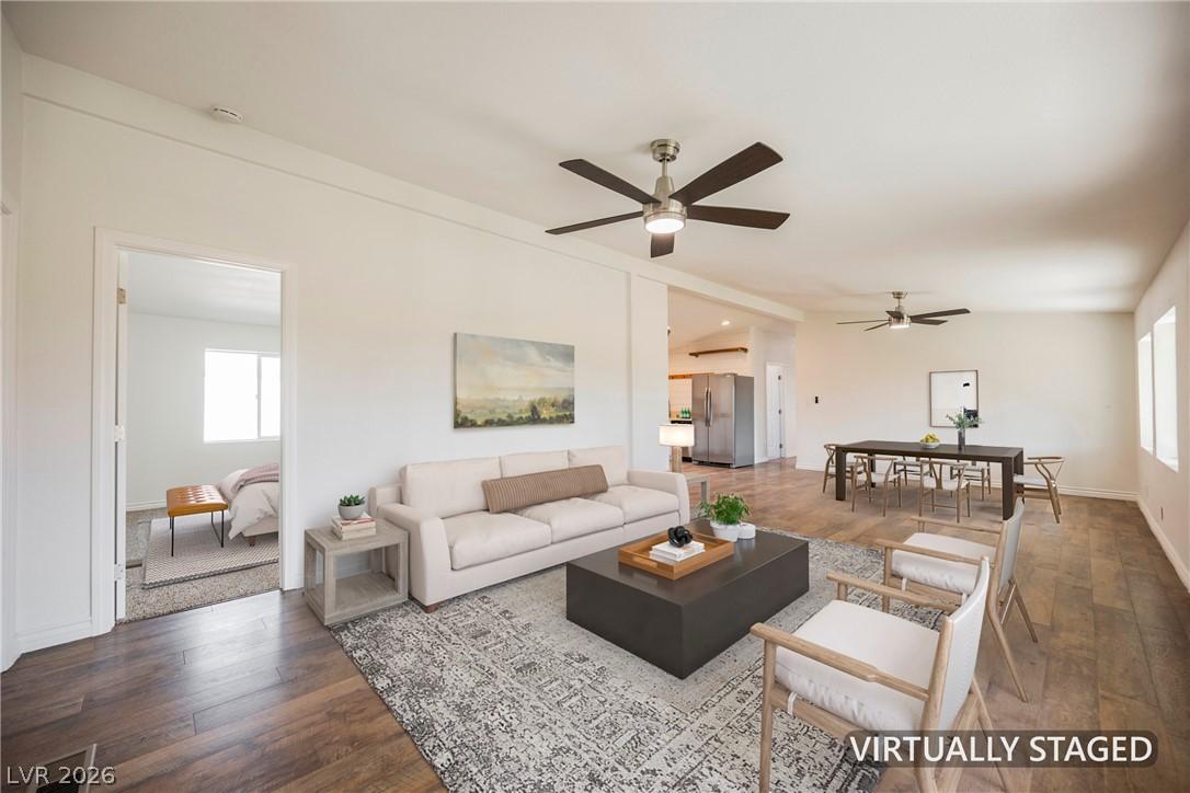 Image 4: An open-concept living and dining area, virtually