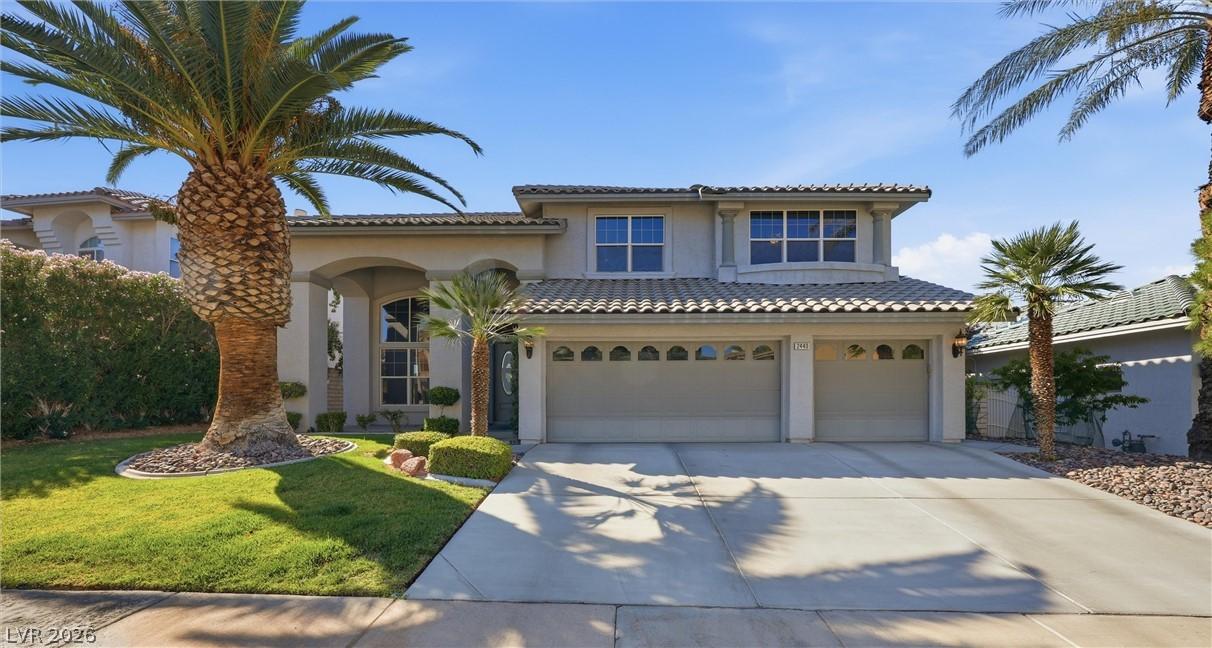 Image 1: A grand two-story residence with a tiled roof and