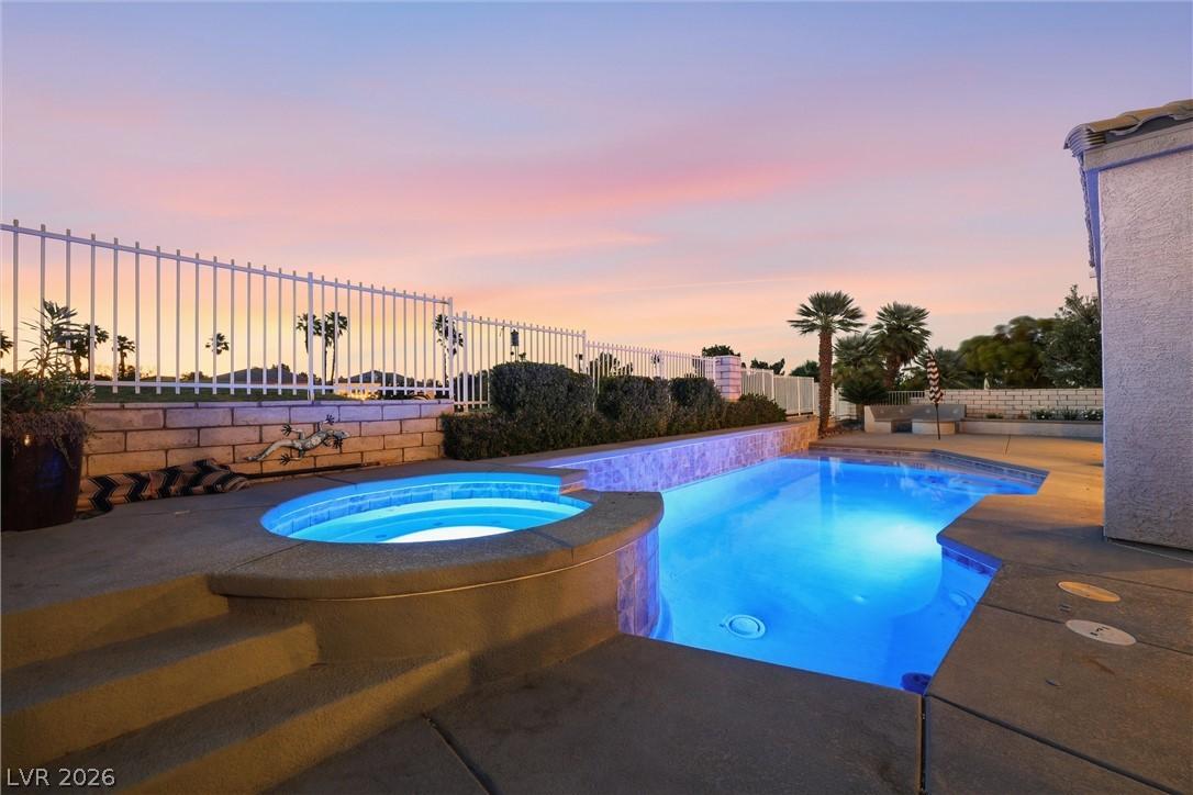 Image 3: Twilight glow illuminates this private backyard oa