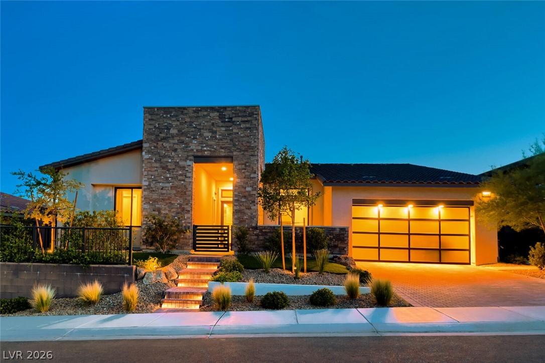 Image 2: Modern desert home glows with inviting light, show