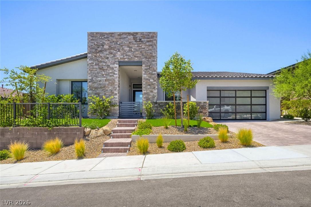 Image 3: Modern desert architecture with a striking stone f