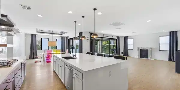 Image 4: An open-concept living space integrates a stylish