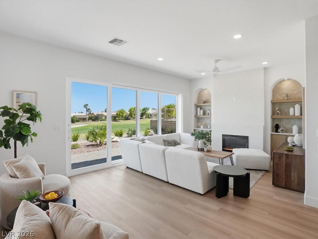 Image 1: Sliding glass doors open this living space to a vi