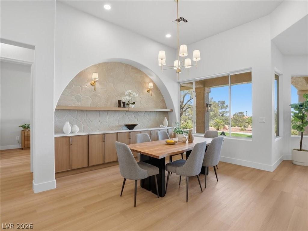 Image 3: Natural light floods this inviting dining space, f