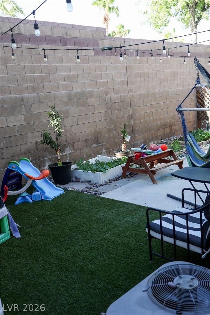 Image 3: A private yard presents an inviting space with art