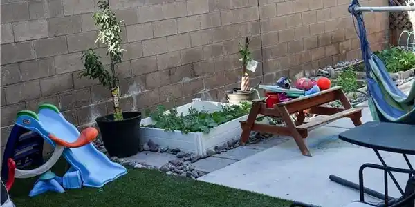 Image 3: A private yard presents an inviting space with art