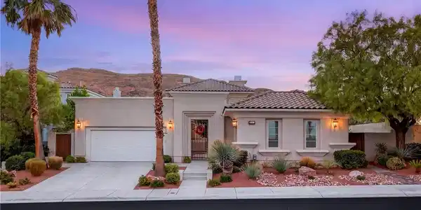 Image 2: Desert landscaping and a tiled roof complement thi