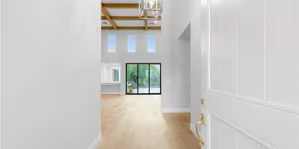 Image 3: An inviting entrance foyer reveals light hardwood