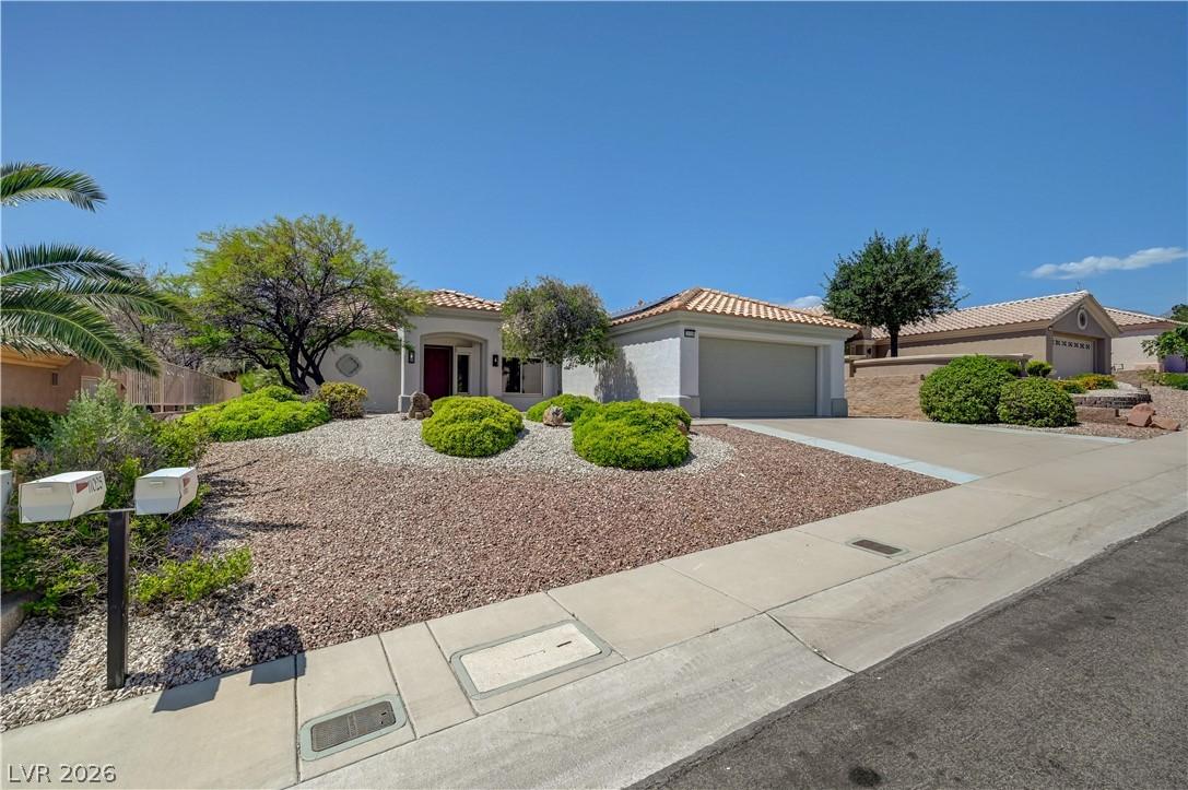 Image 4: This charming home offers a well-maintained exteri