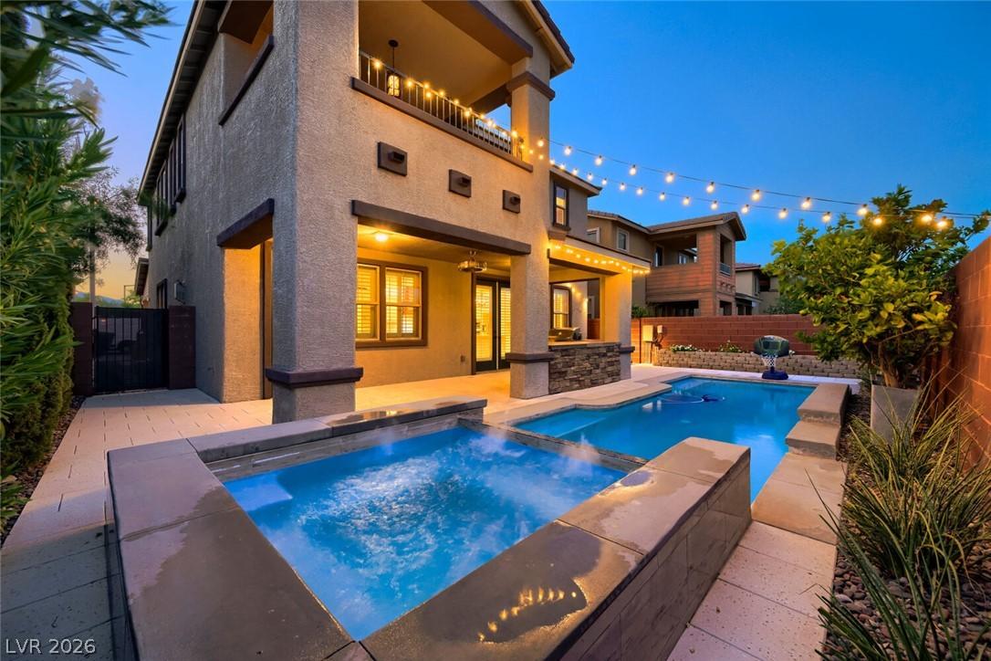 Image 2: An inviting backyard oasis offers a sparkling pool