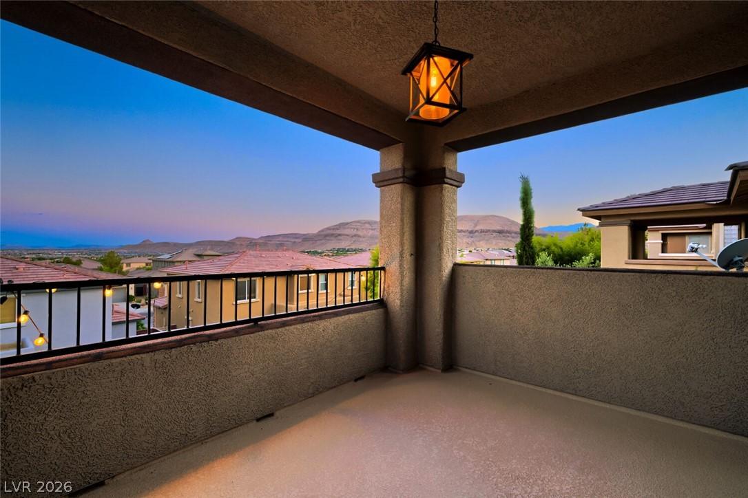 Image 3: A spacious covered patio offers sweeping mountain