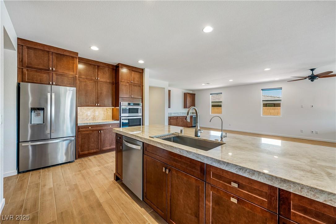 Image 3: Kitchen with appliances with stainless steel finis