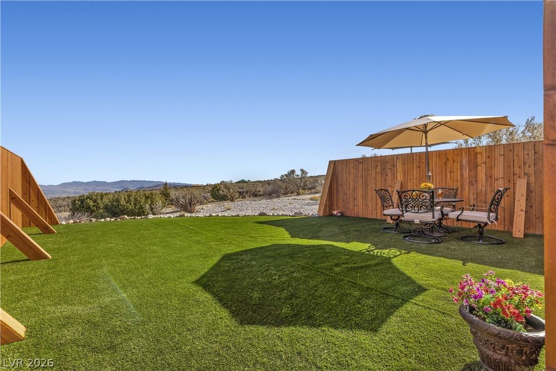 Image 2: Outdoor spaces include cedar privacy fencing, synt