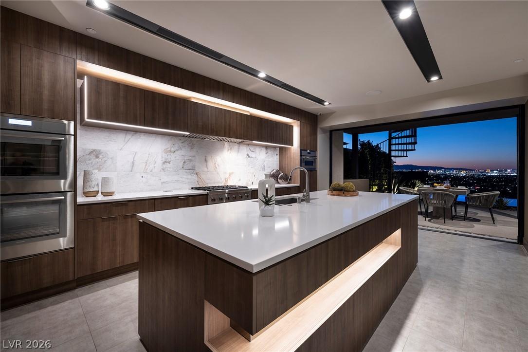 Image 2: Culinary delights await in this modern kitchen wit