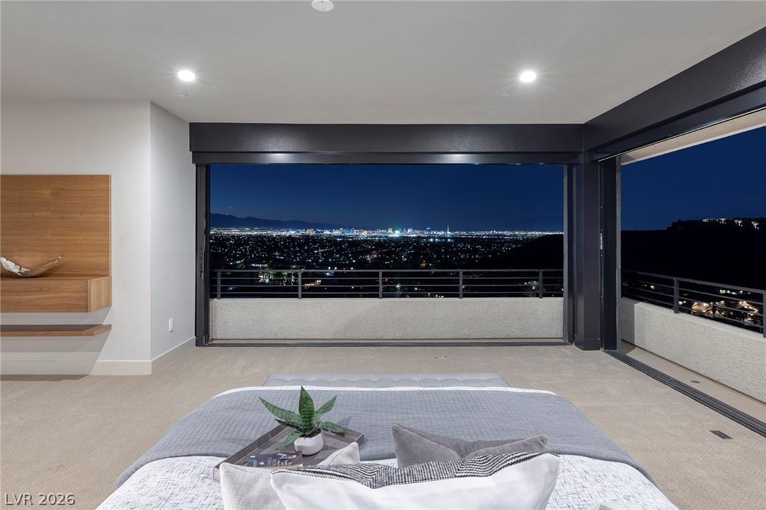 Image 3: Bedroom with sliding glass doors opening to a priv