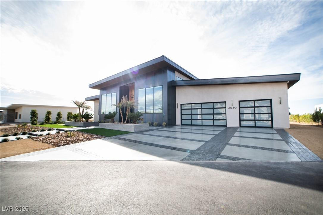 Image 3: Modern home featuring a garage