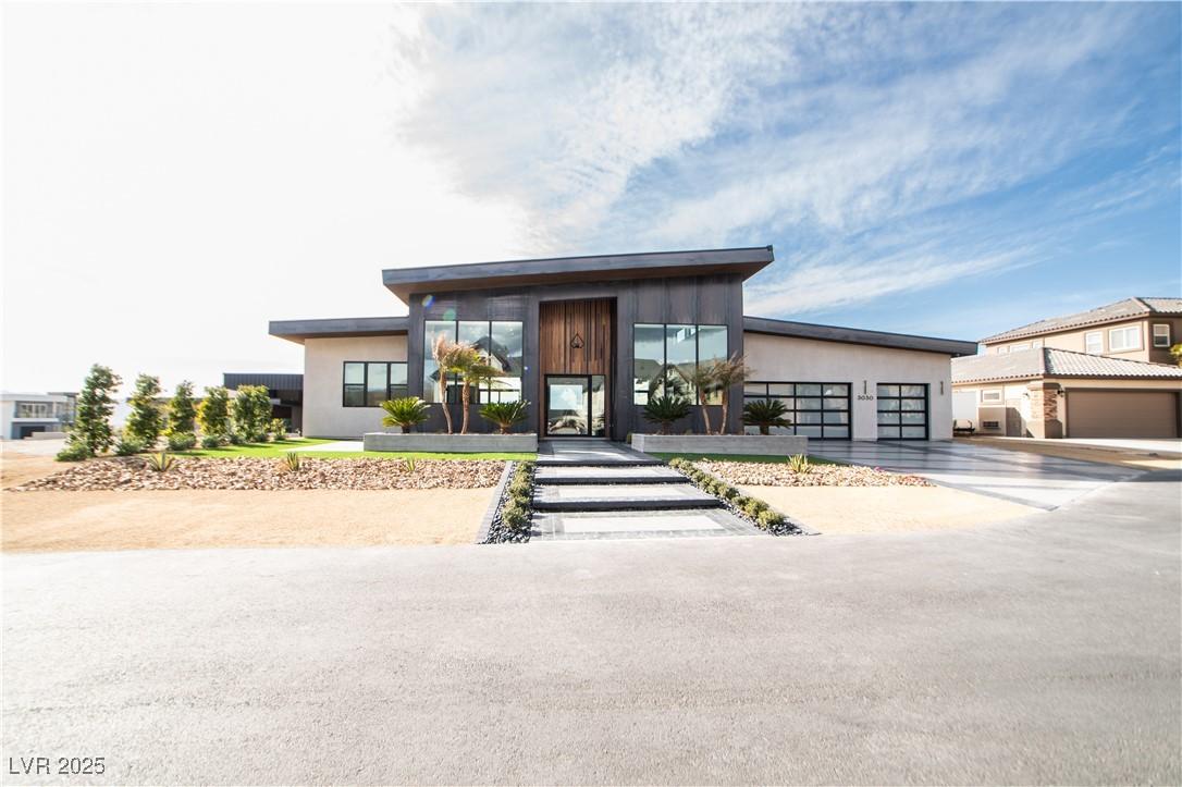 Image 4: Contemporary home with a garage