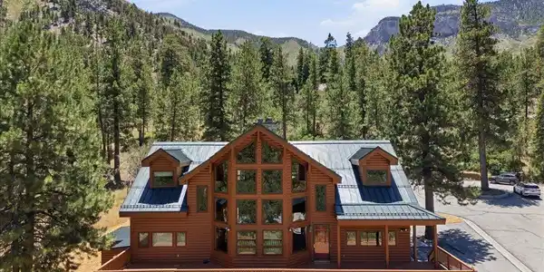 Image 3: A striking mountain-side retreat features a deep w