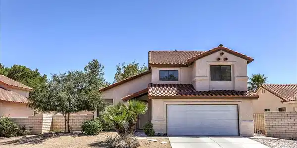 Image 3: This residence features a convenient garage, a wel