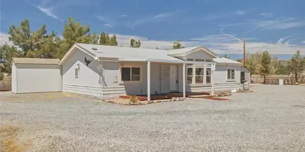 Image 2: A well-maintained single-story home with a spaciou