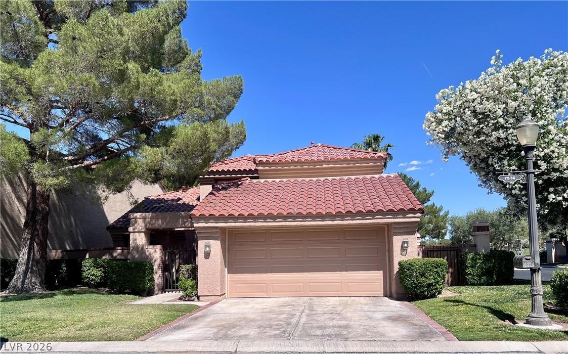 Image 1: This residence features classic tile roofing and a