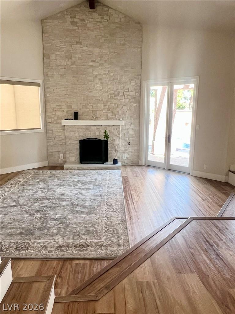 Image 4: This airy living room features vaulted ceilings, a