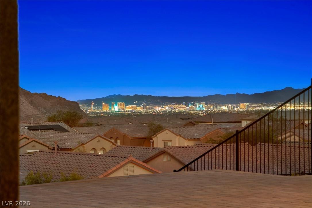 Image 1: The Strip and city lights sparkle against the dist