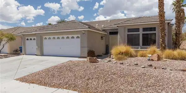 Image 2: Desert landscaping and a tiled roof enhance the cu