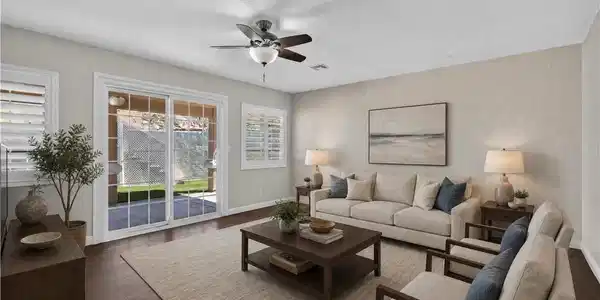 Image 4: Rich hardwood floors and sliding glass doors highl